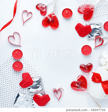 white background with red hearts, condoms, sweet white background with red hearts, condoms, sweet 48047736