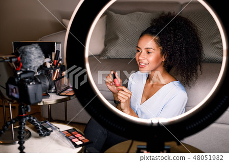 Smiling beauty vlogger recording video  48051982