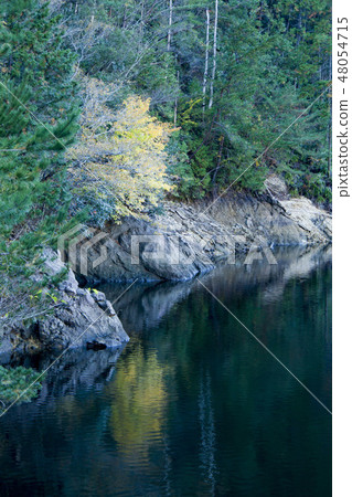 A calm lake surface 48054715