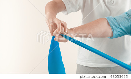 Senior patient and physiotherapist 48055635