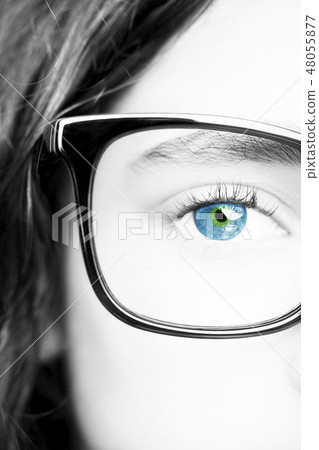 a beautiful young girl wearing glasses. a beautiful young girl wearing glasses. 48055877