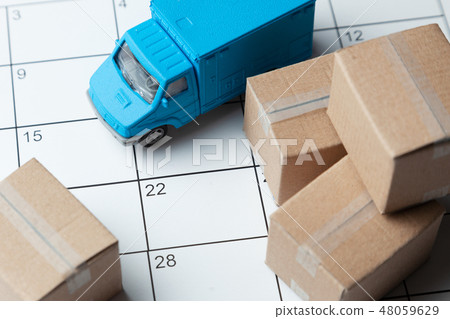 Moving day. Calendar for note with cardboard boxes and truck. 48059629