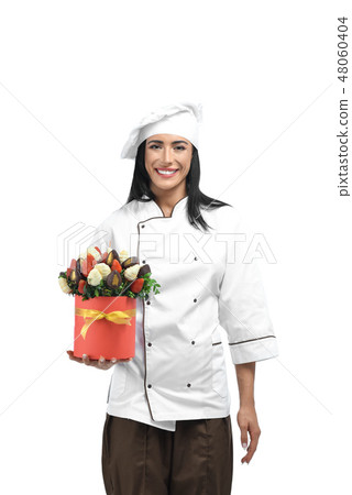 Girl holding box filled with strawberries in chocolate. Girl holding box filled with strawberries in chocolate. 48060404