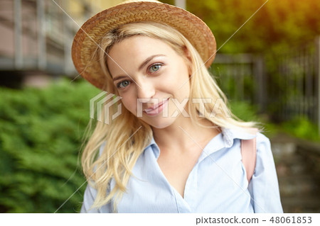 Young student blonde in a straw hat Young student blonde in a straw hat 48061853