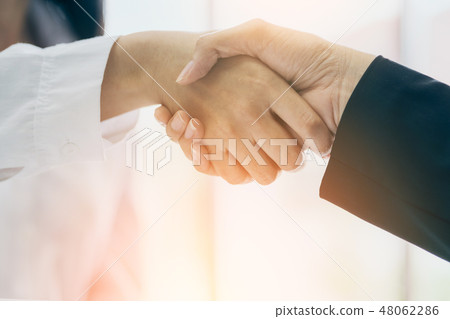 business handshake with two asian manager woman 48062286