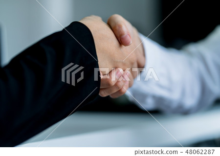 business handshake with two asian manager woman 48062287