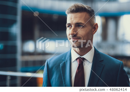 Handsome man in formal wear looking aside 48062414