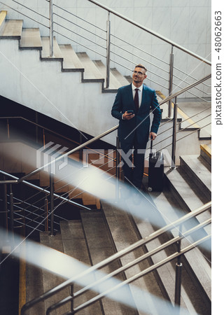 Man waiting international flying and ready going to journey 48062663