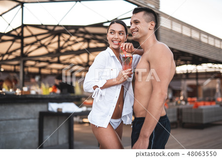 Waist up of young couple enjoying their summer rest and smiling 48063550