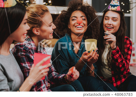 Friends having fun and joking around during party 48063783