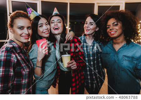 Outgoing females having fun together at night party 48063788