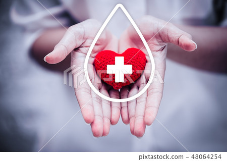hand giving red heart for help blood donation 48064254