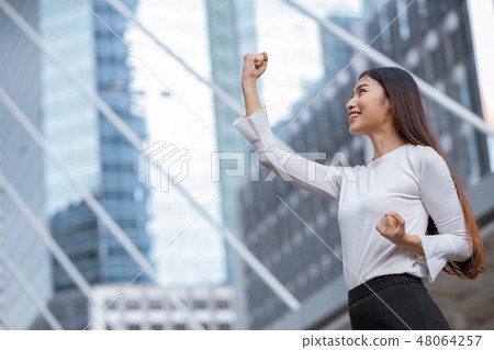 women rise her hand for business winner success women rise her hand for business winner success 48064257