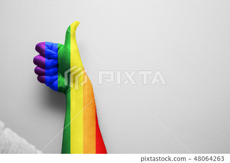 Gay pride LGBT colors paint thumbs up gesture hand 48064263