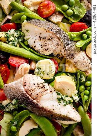 Spring vegetables and cod fillet roast 48064491