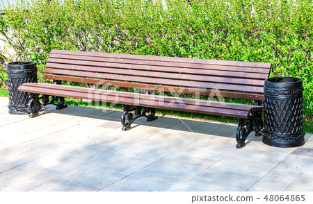 Wooden bench at the city street Wooden bench at the city street 48064865