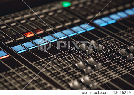 Volume control. Close-up view of sound console buttons for volume setting in sound recording studio 48066299