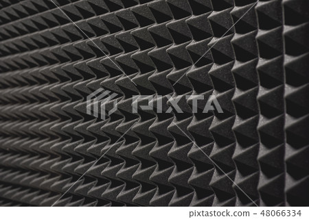 Nobody will hear you. Close up view of a grey soundproof coverage on the wall in music studio. 48066334
