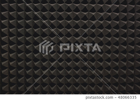 Strong protection from loud music. Close up view of a grey soundproof coverage for a recording 48066335