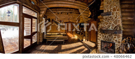 country style interior in hunter chalet with fireplace 48066462