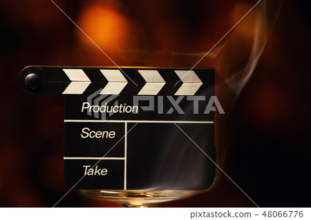 clapperboard smoke gold bokeh  48066776
