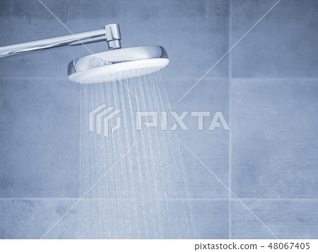 Flowing water from shower head at bathroom 48067405