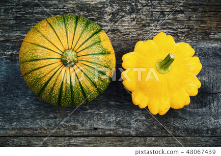 Pumpkin and peter pan squash on wood Pumpkin and peter pan squash on wood 48067439