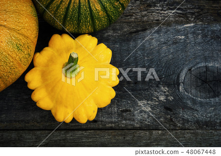 Pumpkin and peter pan squash on wood Pumpkin and peter pan squash on wood 48067448