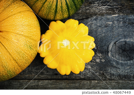 Pumpkin and peter pan squash on wood 48067449