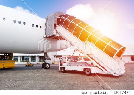 Plane ladder connected to airplane at the airport 48067474