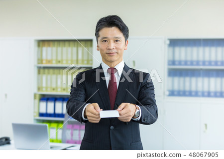 Middle businessman card exchange 48067905