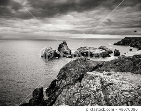 The rocky and picturesque coast of Kynance Cove in Cornwall 48070080