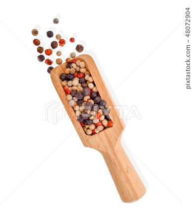 dried peppers in wood scoop isolated on white  48072904