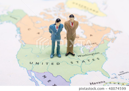 businessman standing on map American businessman standing on map American 48074599