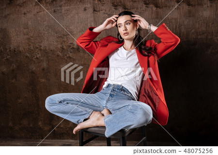 Beautiful thoughtful woman posing for a photo Beautiful thoughtful woman posing for a photo 48075256