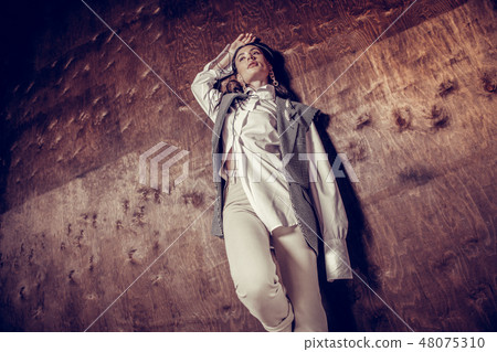 Low angle of a nice dreamy young woman 48075310