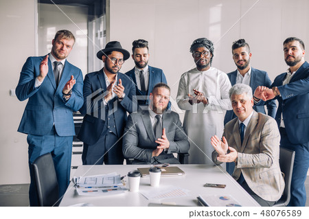 Multiracial group of business team consisting of men only with Executive indoor Multiracial group of business team consisting of men only with Executive indoor 48076589