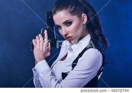 special tactics sexy woman holding up her weapon 48078794