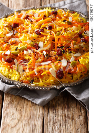 Iranian jeweled rice with dried fruits, carrots 48079077