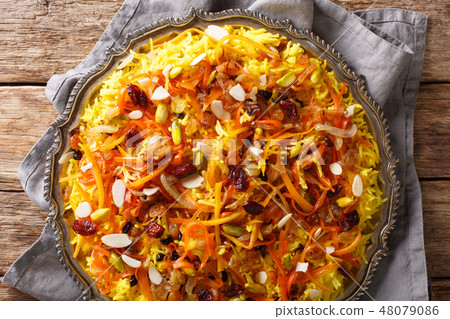 Saffron pilaf with dried fruits, carrots 48079086