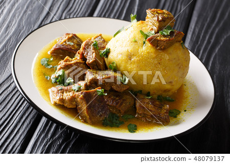 Traditional Mofongo with plantains, garlic Traditional Mofongo with plantains, garlic 48079137