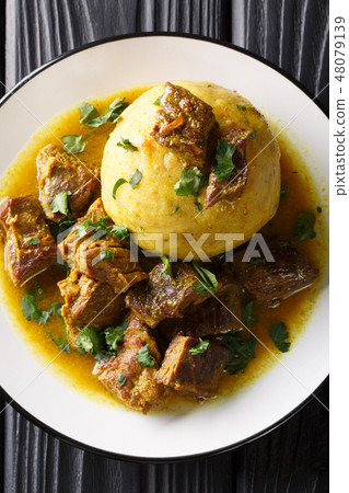 Mofongo made of plantain and chicharron Mofongo made of plantain and chicharron 48079139