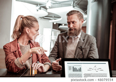 Kind bearded man looking at his girlfriend 48079554