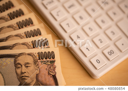 Image of calculator and money Image of calculator and money 48080854