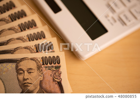 Image of calculator and money Image of calculator and money 48080855