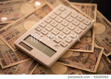 Image of calculator and money Image of calculator and money 48080868