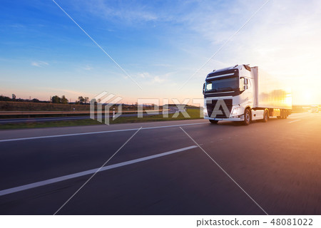Loaded European truck on motorway in sunset 48081022