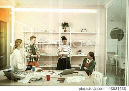 Office workers holding colorful thinking hats sharing their ideas 48081388