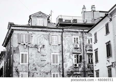 Old private houses in Piran, Slovenia, colorless Old private houses in Piran, Slovenia, colorless 48086551