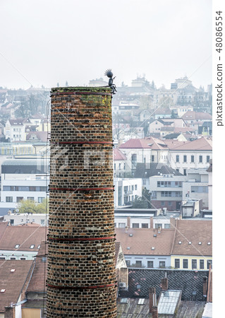 Chimney with figure in center of Trebic, Czech Chimney with figure in center of Trebic, Czech 48086554
